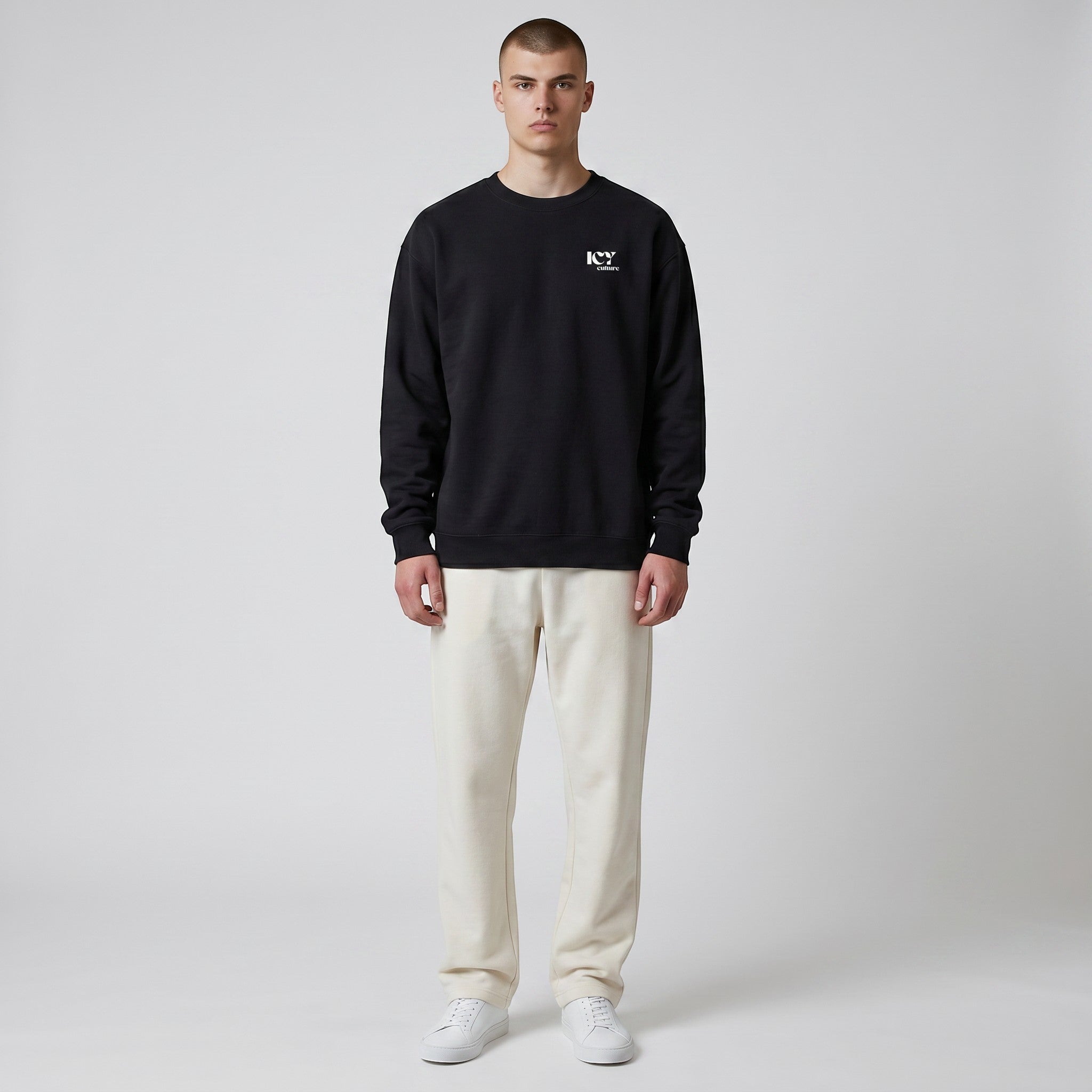 Icy Culture black crewneck sweatshirt with minimalist logo on front, made of cotton blend.