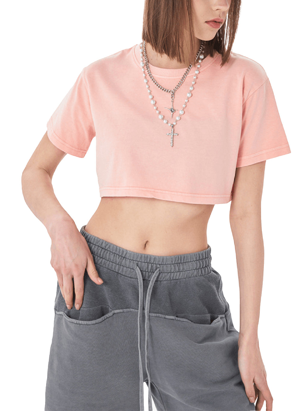Icy Culture top de algodão 100% rosa pálido, com corte cropped, gola redonda e mangas curtas. Lavagem desbotada.