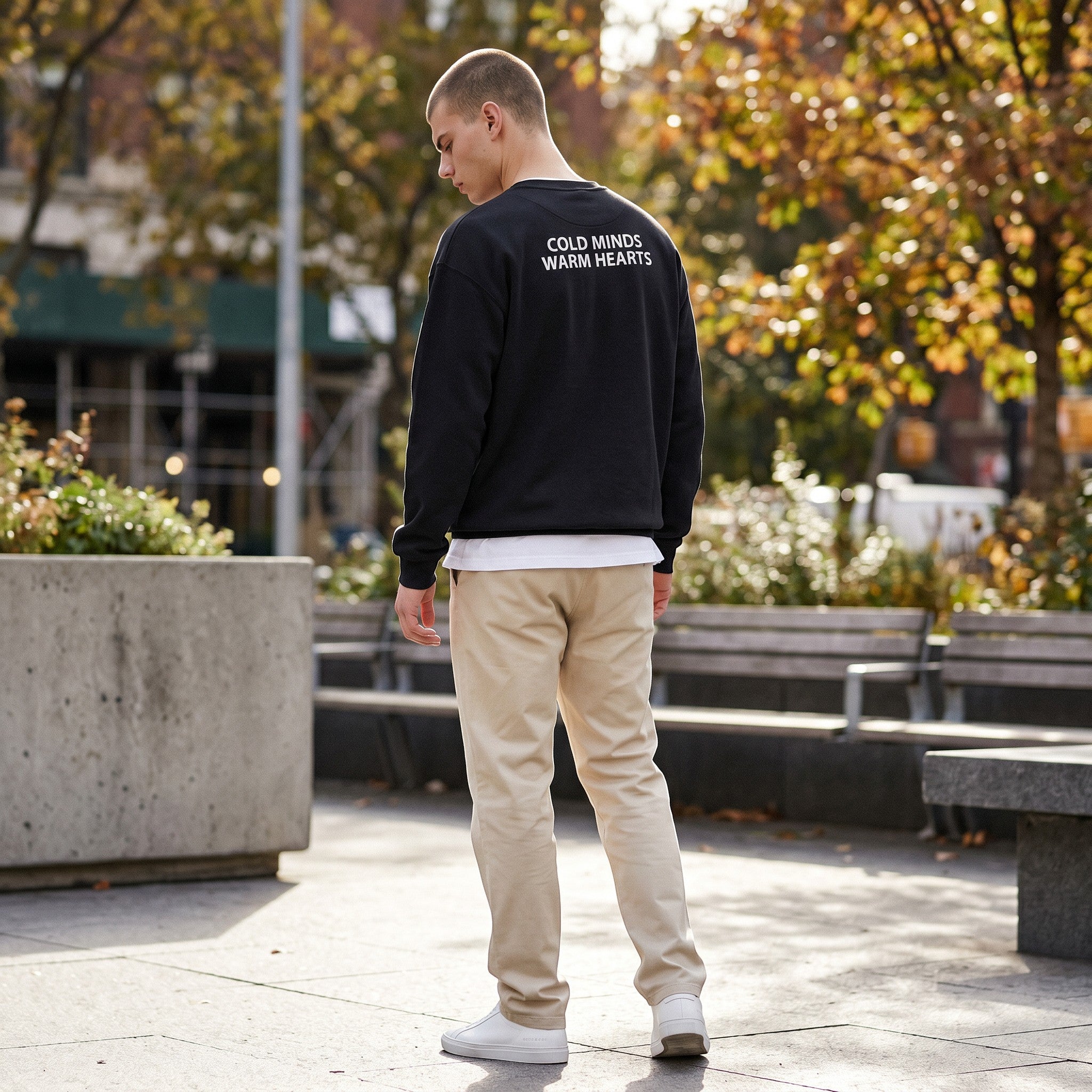 Icy Culture Equilibrium crewneck sweatshirt in black, featuring "COLD MINDS WARM HEARTS" print on back. Unisex fit, 50% cotton/50% polyester.