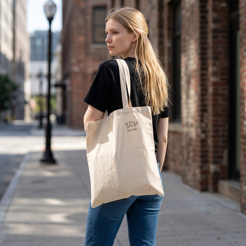 Icy Culture natural cotton canvas tote bag, 15" x 16", with 20" handles and subtle logo.