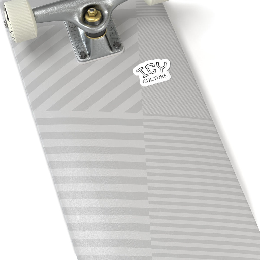 Icy Culture sticker with black outline on a grey striped skateboard deck. Vinyl sticker.