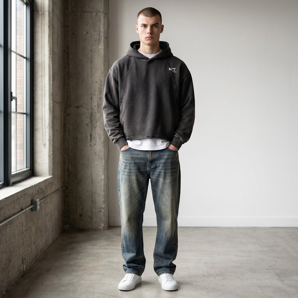 Icy Culture unisex loose-fit vintage washed charcoal grey cotton-blend hoodie with frayed hem and small white logo.