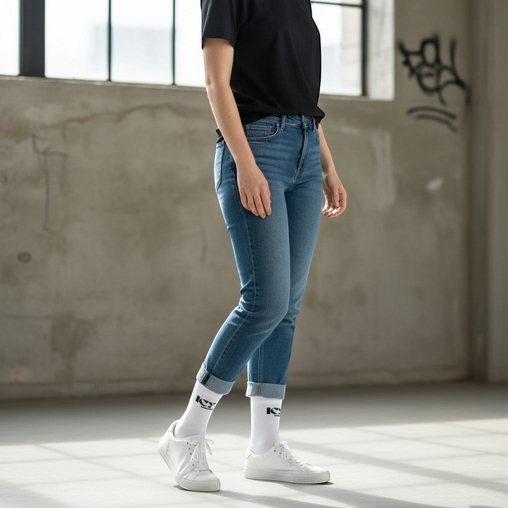 Icy Culture white crew socks with black logo detail, made from a polyester-spandex blend for comfort.
