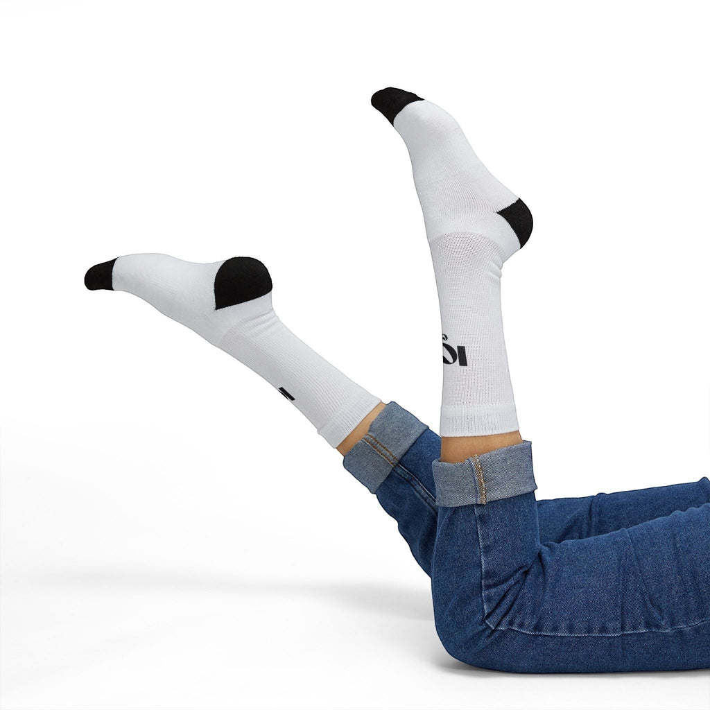 Icy Culture white crew socks with black toe and heel, featuring a subtle logo detail. Made from a polyester-spandex blend for comfort.