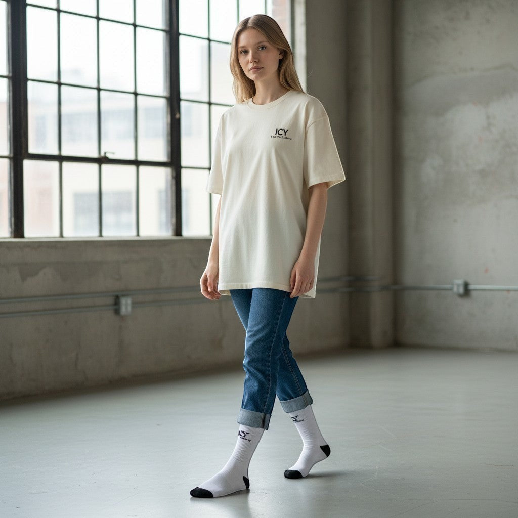 Icy Culture white crew socks with black toe and heel, featuring a small black logo detail on the ankle.