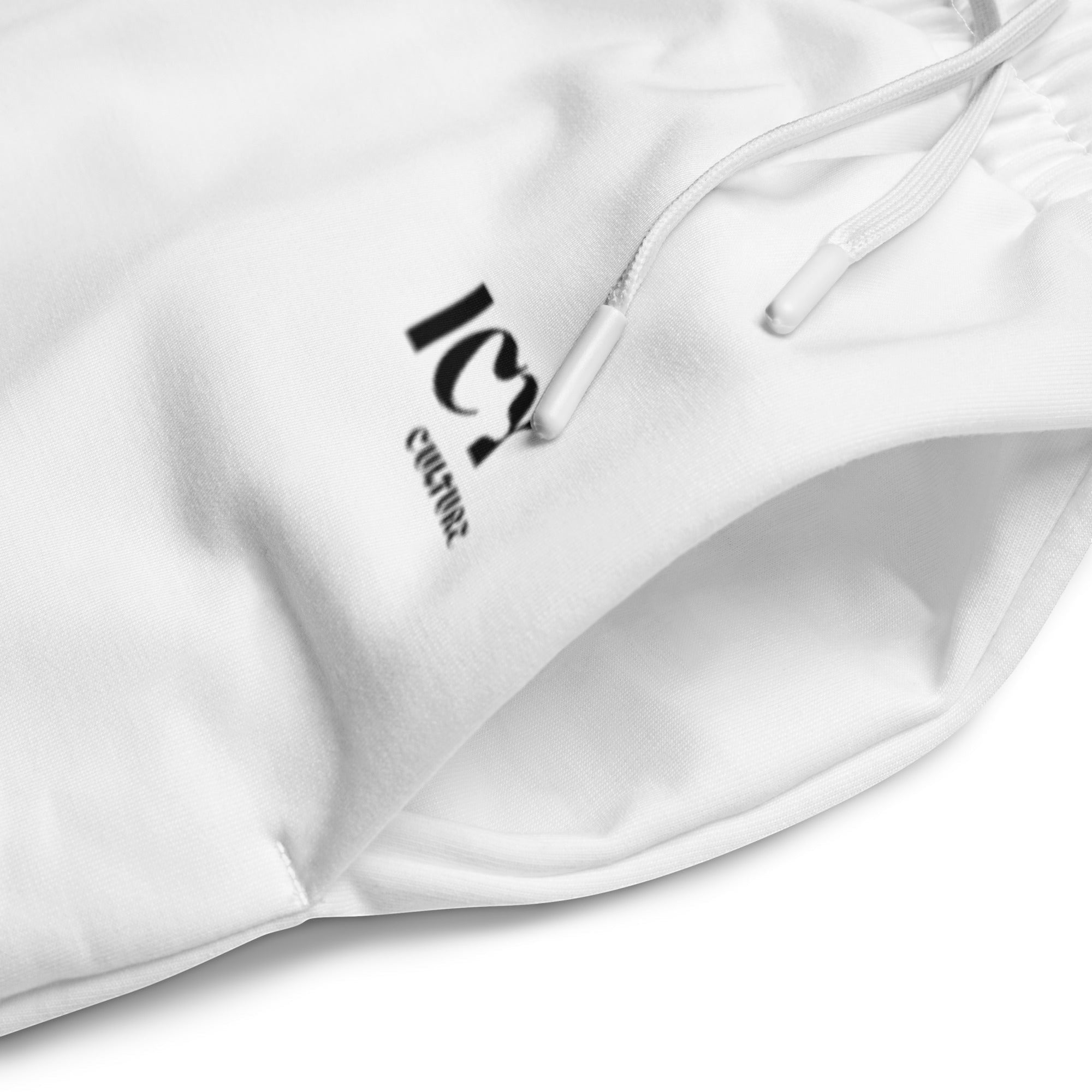 Icy Culture white wide-leg joggers with black logo, drawstring waist and side pockets. Made from recycled polyester and elastane.