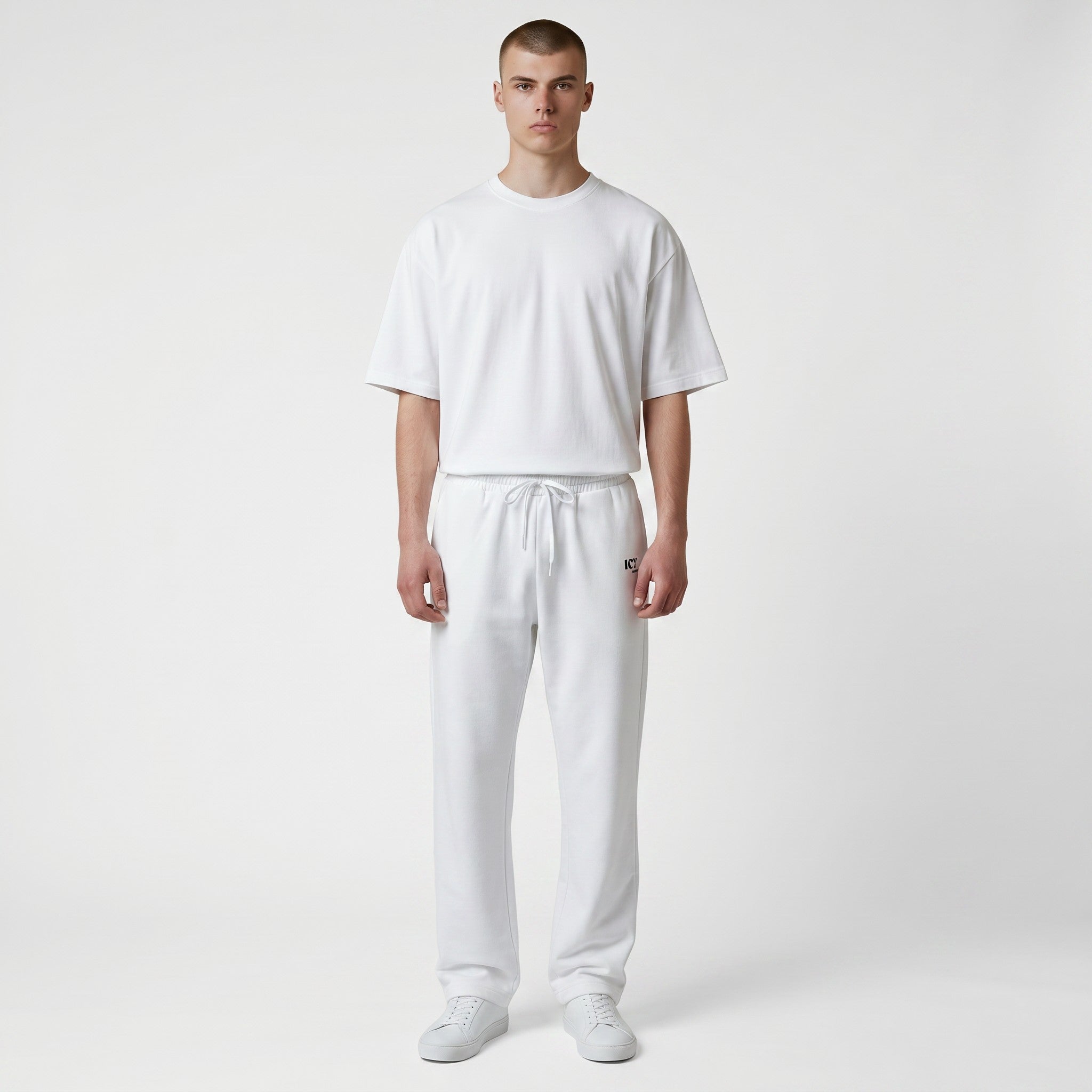 Icy Culture white wide-leg joggers with drawstring waist and side pockets, made from recycled polyester and elastane.